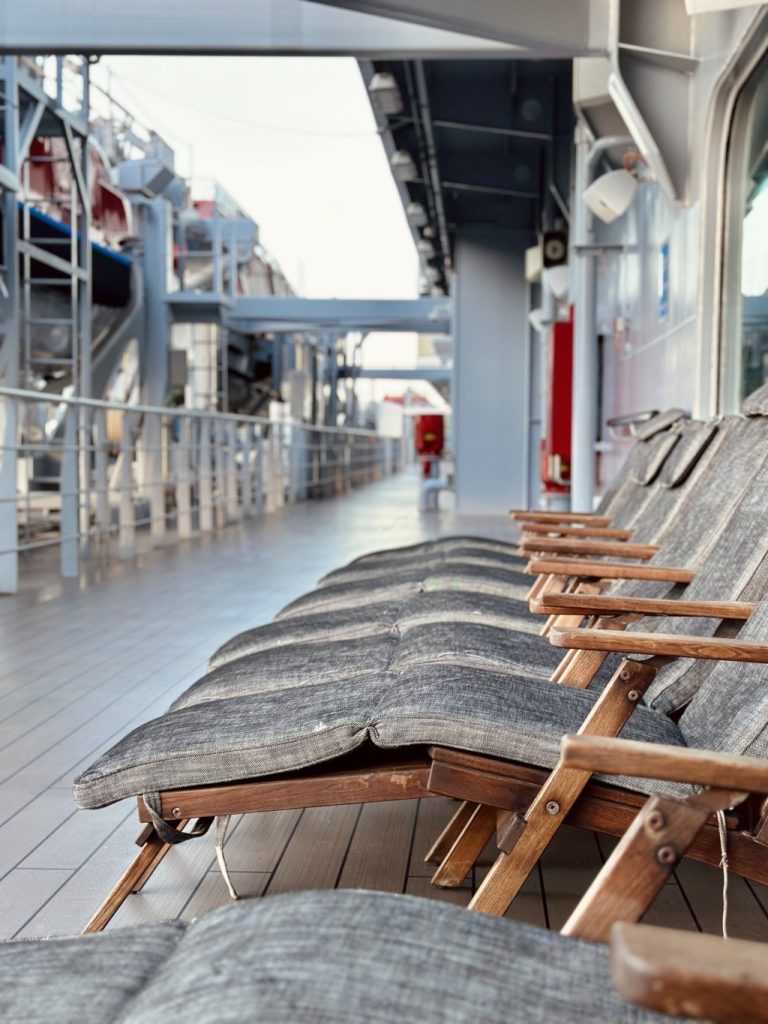 Wooden deck chairs in marine style