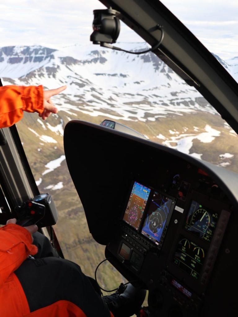 Flighseeing heli cockpit over Island