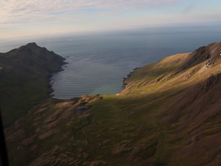 Island coast with Scenic Eclipse in the background