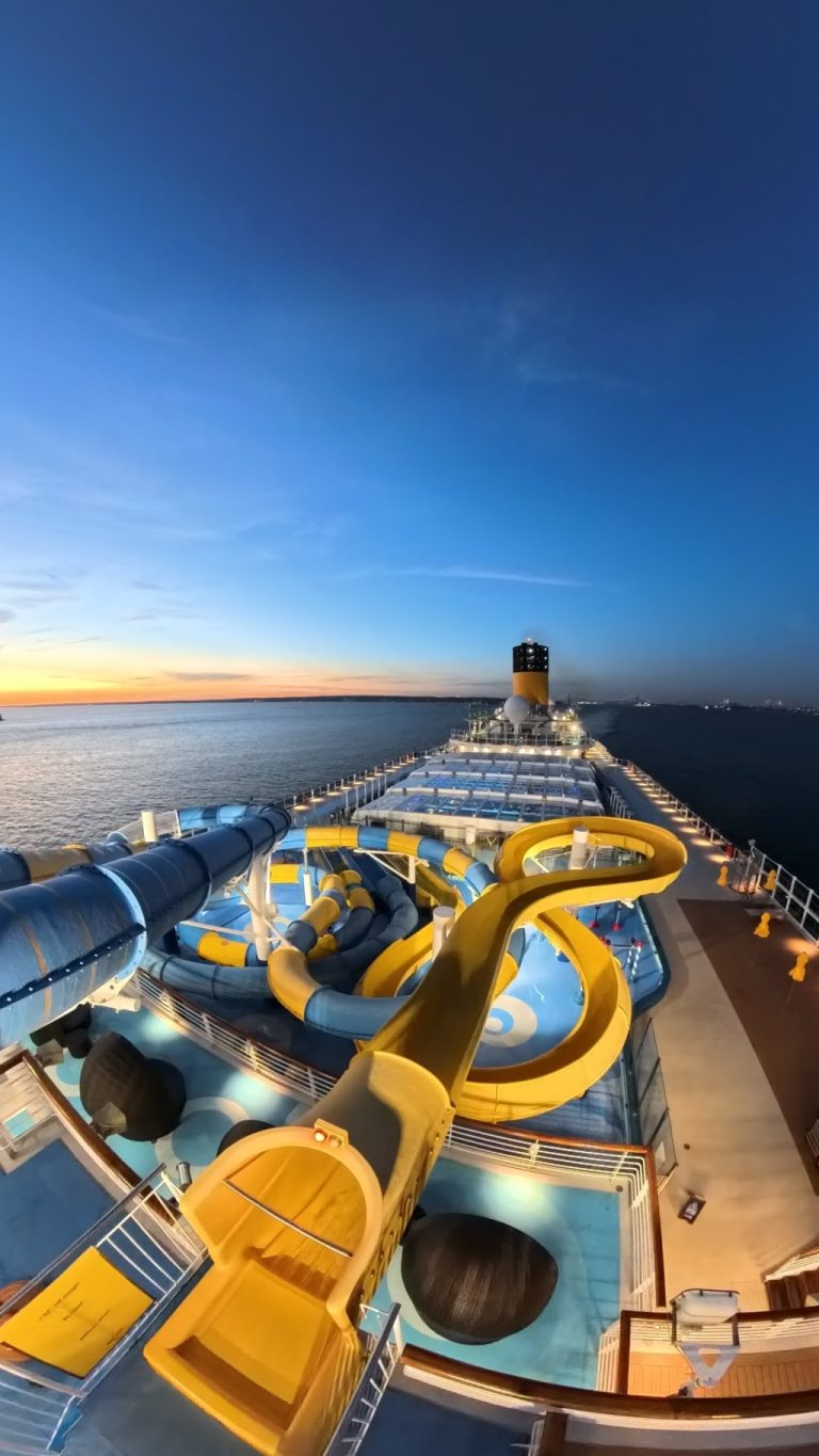 Carnival Venezia Water slides and yellow funnel at blue hour