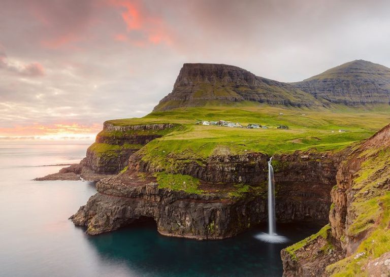Mulafossur waterfall in Gasadalur on at sunny day Mulafossur waterfall in Gasadalur on at sunny day